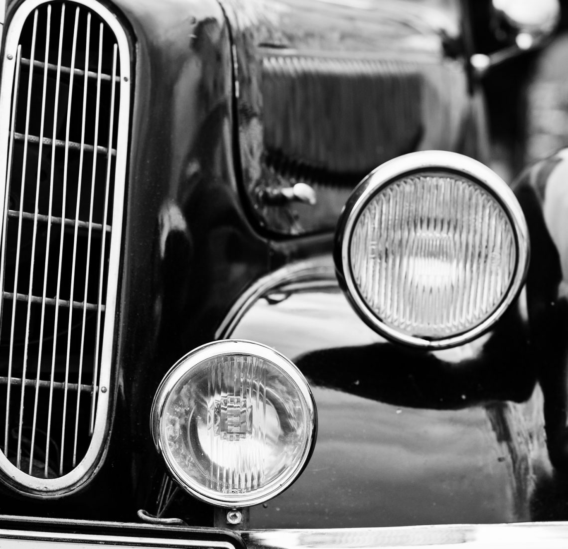 Retro car headlight. Front of old vintage car